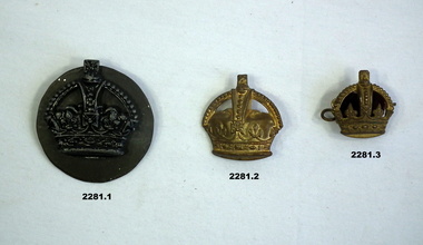 Three badges part of a wider collection.