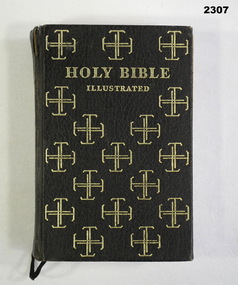 Brown and gold covered Holy Bible.