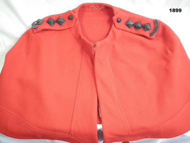 Nurses red cape with rank badges.