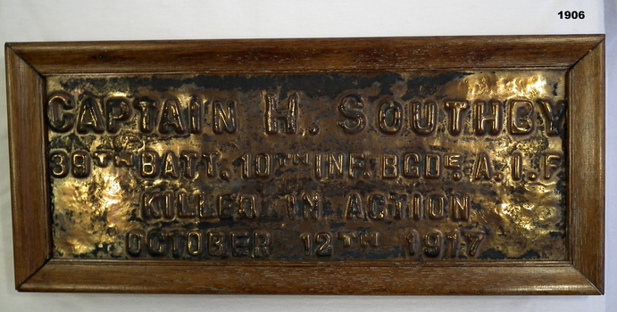 Bronze plaque re the death of a soldier in WW1.