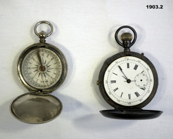 Compass and watch with folding face.