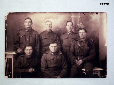 Photo showing six soldiers with text on the rear