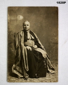 Sepia tone postcard showing he Bishop of Amiens