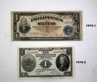 Two currency notes, Dutch and Phillipines.