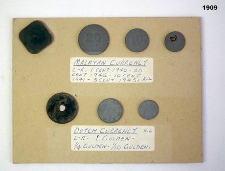 Various malayan and Dutch coins.