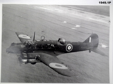 Photograph showing an aircraft in flight