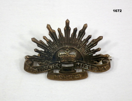 Brass Rising Sun hat badge