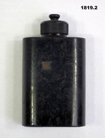Black coloured Bakelite oil bottle.