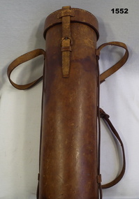 Cylindrical brown leather case with carry strap
