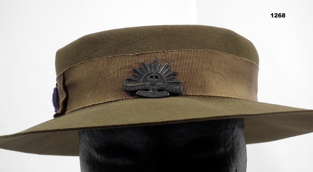World War Two Australian Women's Army Service hat with Rising Sun badge and unit colour patch.