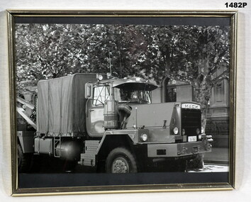 B & W photo showing an Army Mack truck.