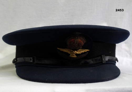 Blue RAAF peak cap with set of wings on front.