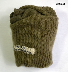 Pair of khaki socks with tag on.
