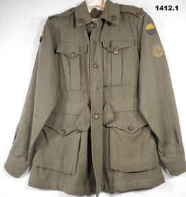 World War One Australian Army battle dress jacket with badges and unit colour patch.
