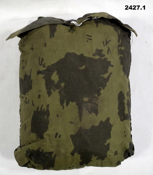 Camouflage raincoat folded into its pocket