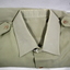Poly shirt with tie and Webb belt accessories.