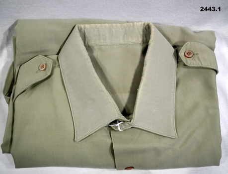 Poly shirt with tie and Webb belt accessories.