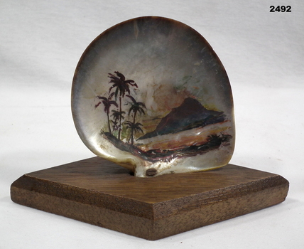 Island scene painted on a shell.