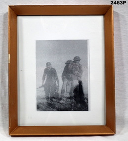 Photo showing two soldiers and one German.