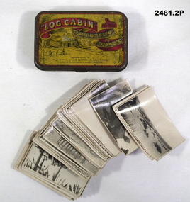 Log cabin tobacco tin with 57 photos.