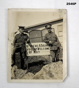 Two soldiers in front of sig, WWI