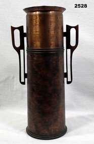 Trench art vase made from a shell casing.