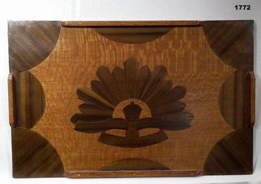 Wood inlay tray with rising sun depiction.