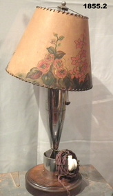 Lamp and shade made from a deactivated mortar bomb.