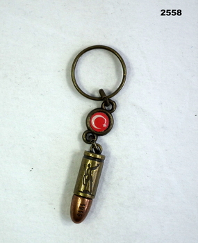 Key ring with Turkish symbol and replica bullet.
