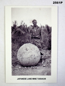 Photograph showing a Japanese mine and soldier.