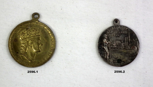 two souvenir medallions with no military connection.