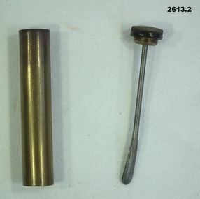 Brass oil bottle container for weapons.