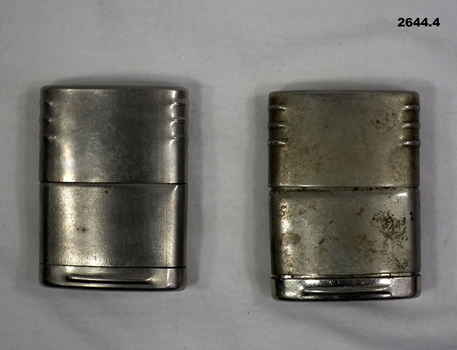 Two silver coloured cigarette lighters WW2 era.
