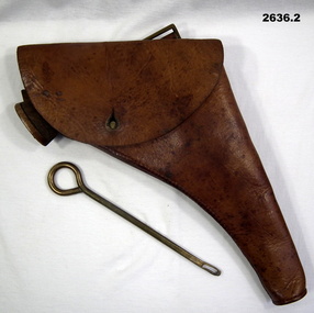 Leather pistol holder and cleaning implement.