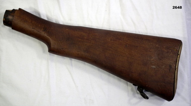 Wood rifle stock on its own.