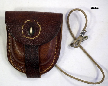 Leather pouch with cord possibly compass.