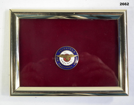 Volunteer Air Observer Corps badge in a frame.