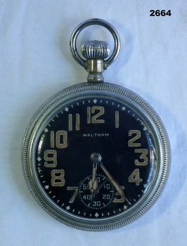 Metal pocket watch with black face.