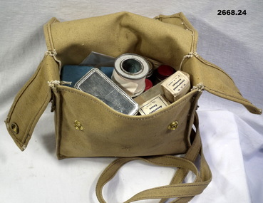 Canvas medical bag with 24 items.