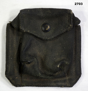 blackened webbing compass carrier with one press stud.