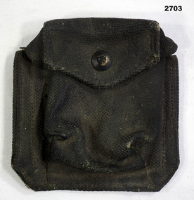 blackened webbing compass carrier with one press stud.