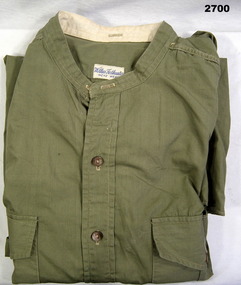 Light colour collarless uniform shirt.