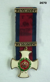 Replica Distinguished Service Cross medal.