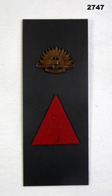 Mounted rising sun lapel badge and colour patch.
