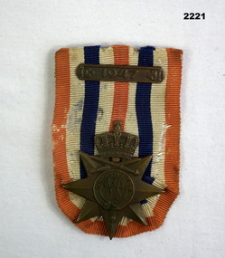 Foreign medal with ribbon dated 1947.
