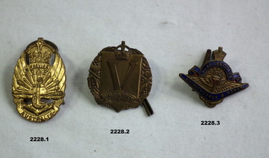 Three badges relating to service and volunteering.