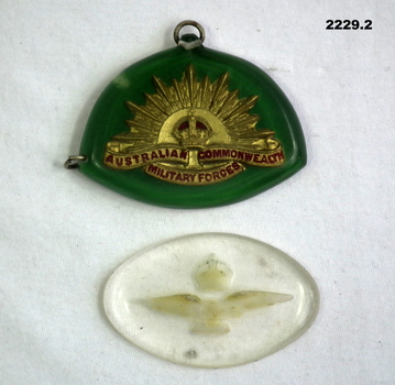 Two Perspex trench art badges WW2