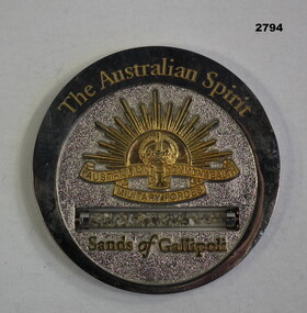 Round medallion with "Sands of Gallipoli" on.