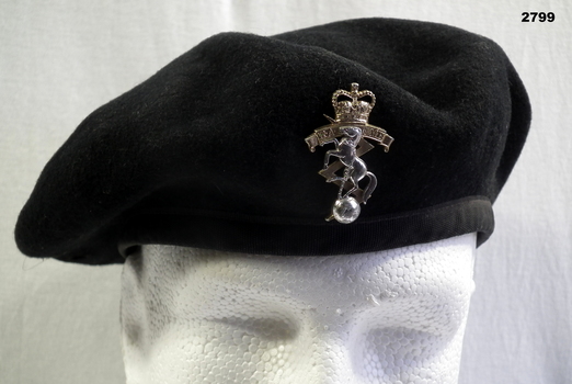 Black beret with RAEME silver badge on front.