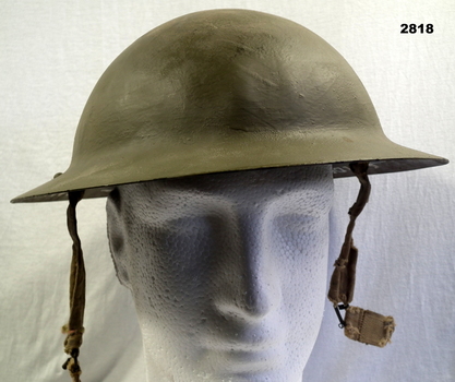 Green coloured steel helmet British pattern.